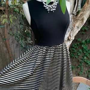 Black dress with glittering gold stripe skirt